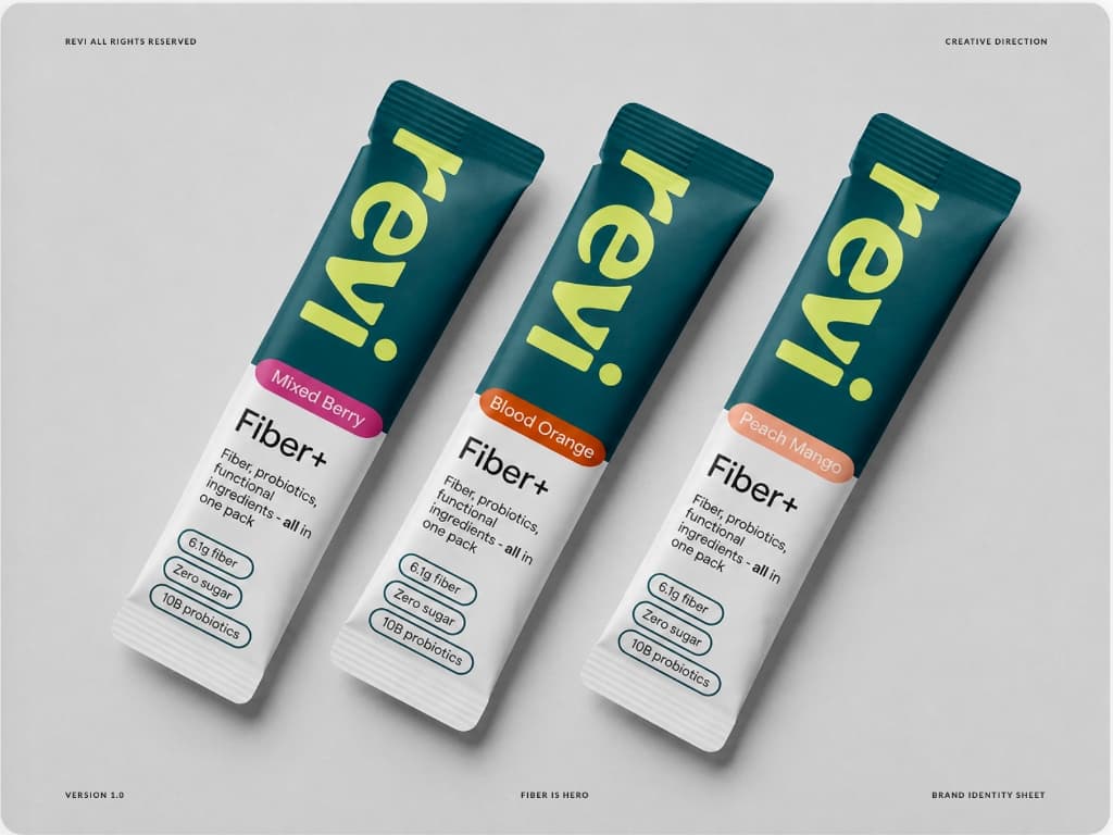 Three Revi Fiber+ stick packs in Mixed Berry, Blood Orange, and Peach Mango flavors